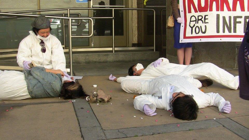 people in tyvek hazmat suits on the ground by the access ramp to the hayes street front entrance to the old new leaf lgbt mental health support services location