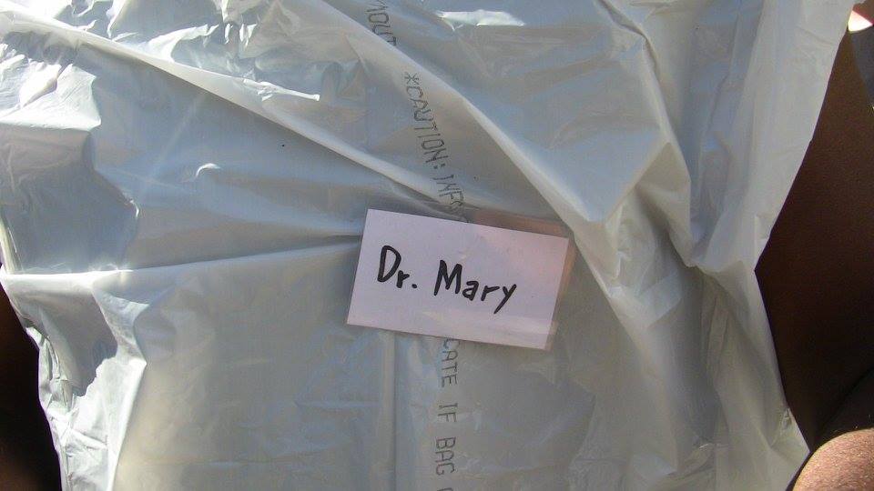 extreme close up of a dr mary nametag on a tyvek suit someone is wearing