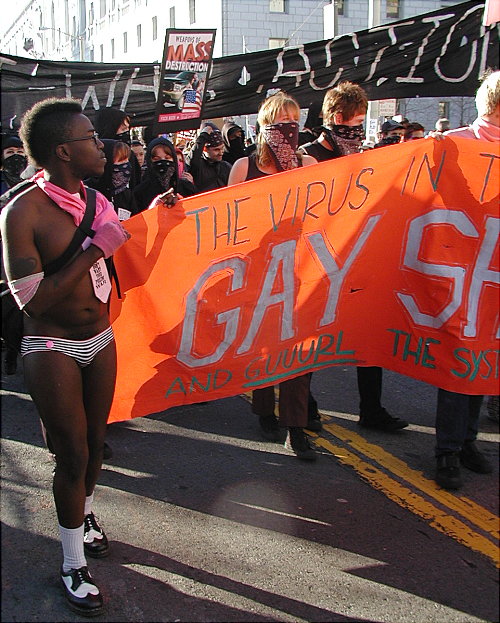 people carrying the "gay shame" banner in front of black bloc with their large black "anti-war action" banner