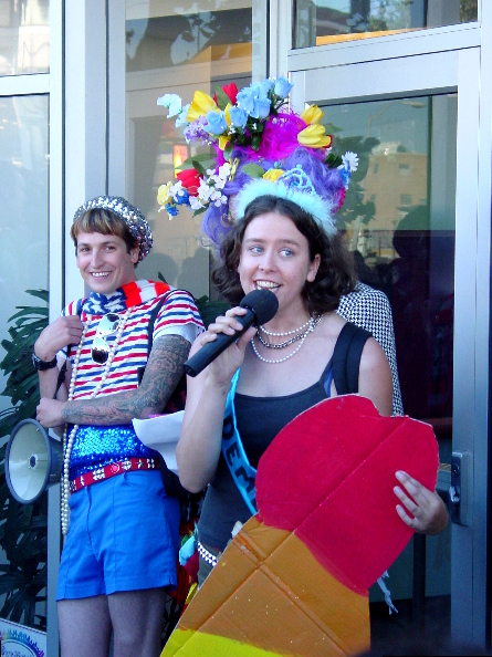 people presenting an award in front of the main entrance of the lgbt center