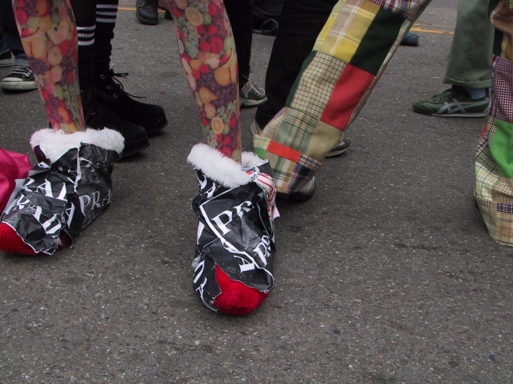 close up of footwear in the crowd filling castro street