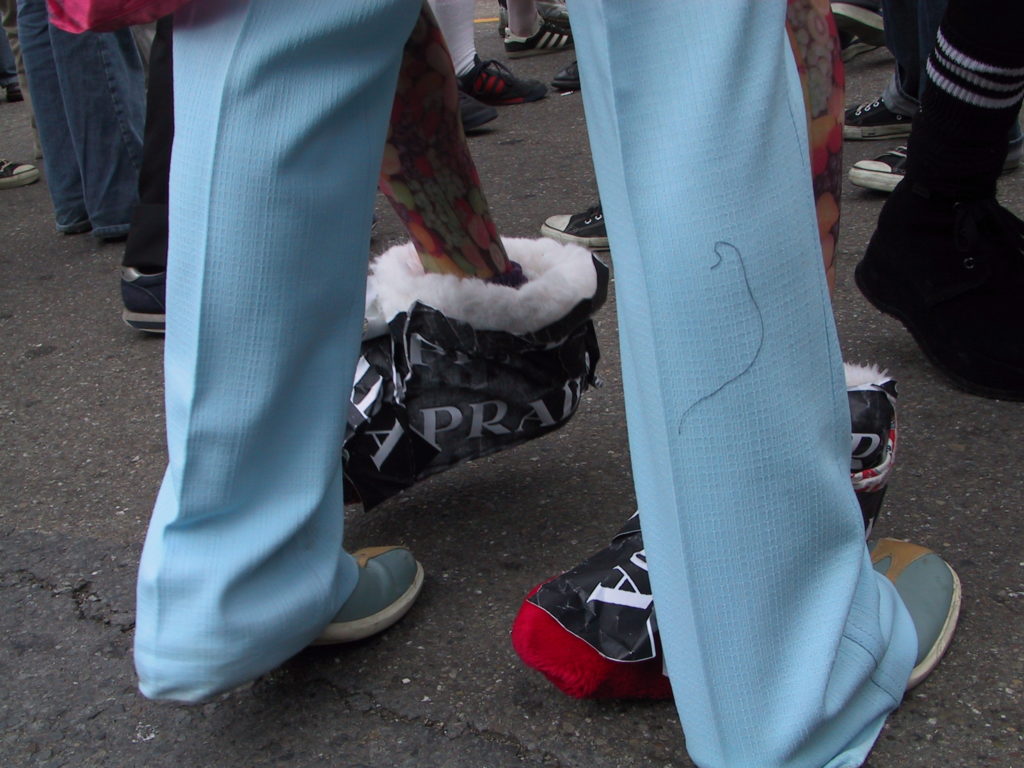 detail of reveler's footwear as the crowd fills castro street